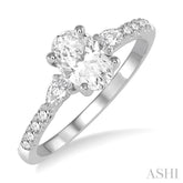 7/8 Ctw Pear & Round Cut Diamond Engagement Ring With 1/2 Ct Oval Cut Center Stone in 14K White Gold